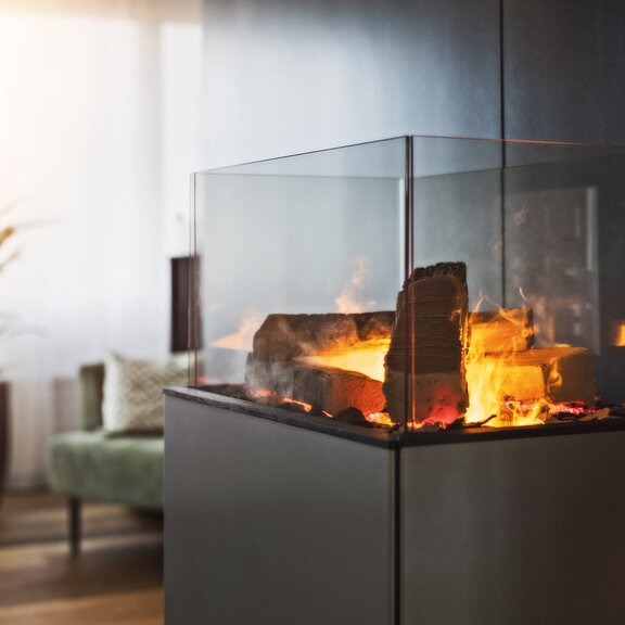 The eSENSE Living electric fire is a plug-in piece of furniture made of steel.