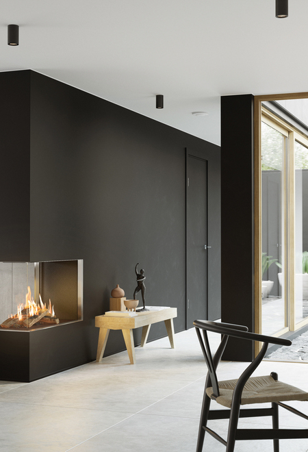 VISIO 90 RD GAS VISIO 90 RD gas fireplace fits perfectly as a room divider in a black wall between the living room and dining room and gives structure to the simply decorated living space