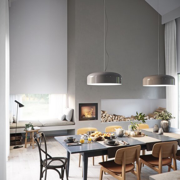 Wood fireplace insert R-600 front version as centrepiece in the dining room with set table