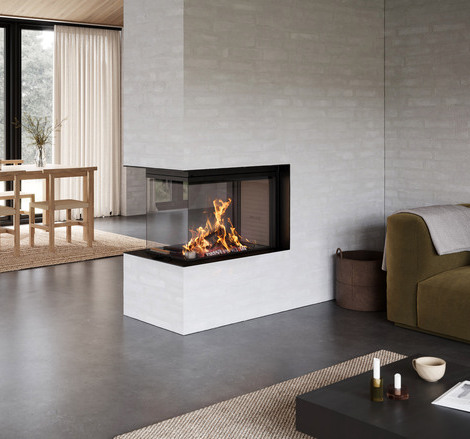 Wood fireplace VISIO 3:1 UNIQ as a room divider between the dining room and living room