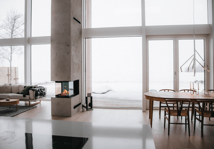 VISIO 3:1 roomdivider Wood fireplace VISIO 3:1 act as a room divider between the dining room and living room in a modern house somewhere in the north