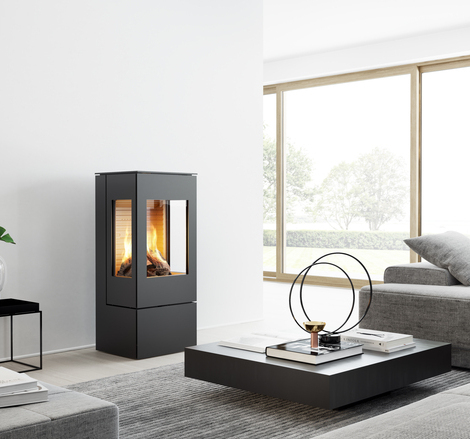 NEXO 100 GAS in black with two side windows Gas stove NEXO 100 in black with steel door and two side windows in a modern, bright living room