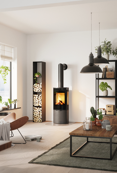 Wood stove CARO 110 in black with glass door and side window in a living room