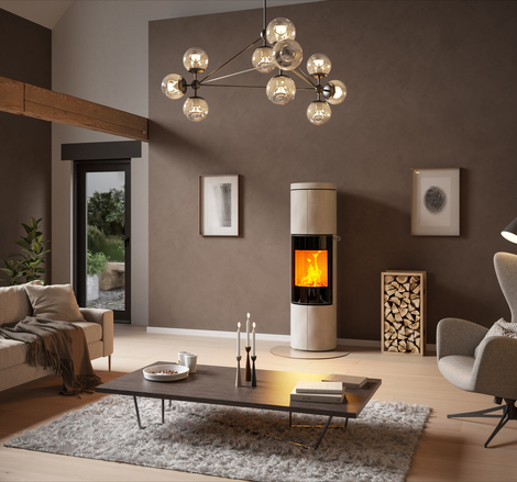 JUNO 166 L with natural stone "Porto" cladding and glass door Wood stove JUNO 166 L with natural stone "Porto" cladding and glass door in a large living room in earthy colours
