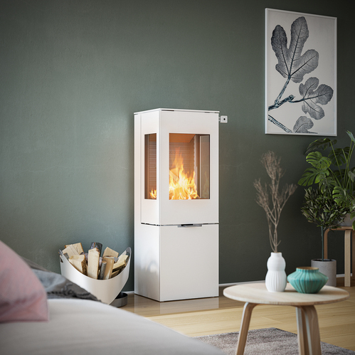 NEXO 120 in white with steel door Wood stove NEXO 120 in white with steel door and two side windows in front of a green wall in a decorative living area