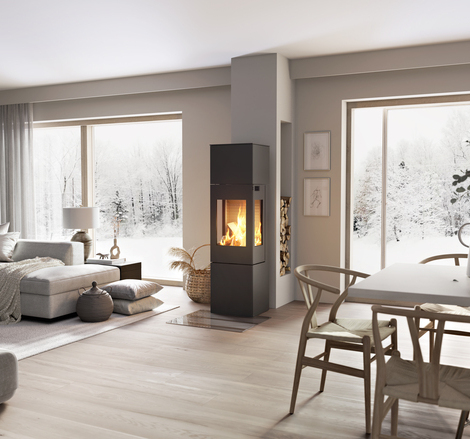 NEXO 160 in black with steel door Wood stove NEXO 160 in black with steel door and side window in the centre of the living room between the dining area and living room