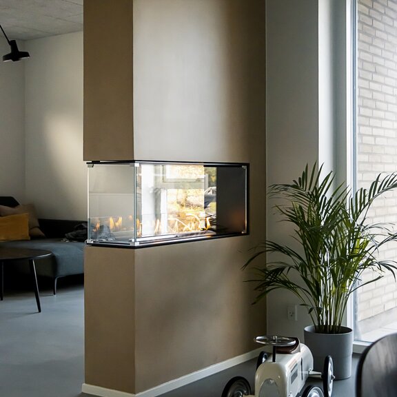 Bioethanol burner Montreal room divider in a modern living room in brown panelling