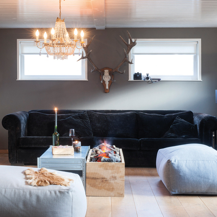 Electric fire Cassette 1000 from Dimplex installed in a wooden box in a rustic living room